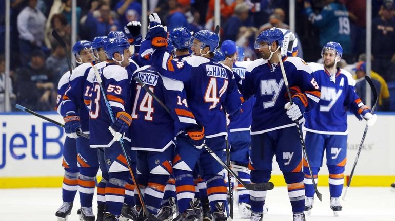 The Islanders celebrate after defeating the San Jose Sharks at...