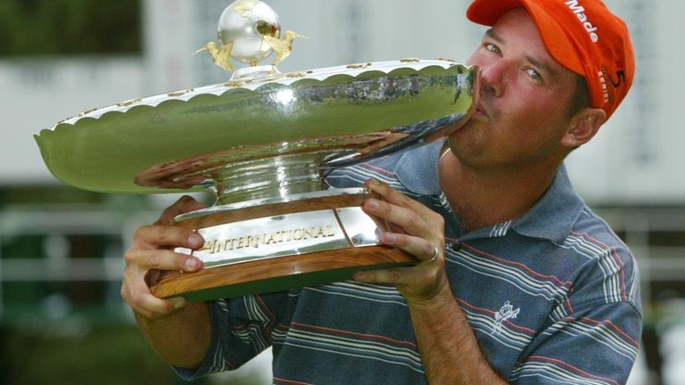 Rich Beem, from Las Cruces, N.M., kisses the trophy after...