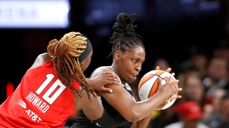 Las Vegas Aces guard Chelsea Gray (12) steals the ball...