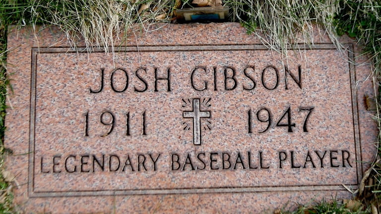 The grave stone for baseball player Josh Gibson is shown...