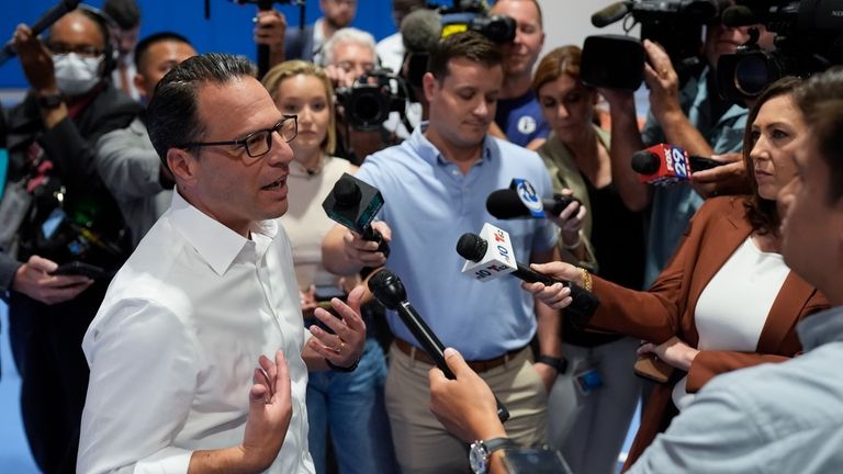 Pennsylvania Gov. Josh Shapiro speaks with members of the media...