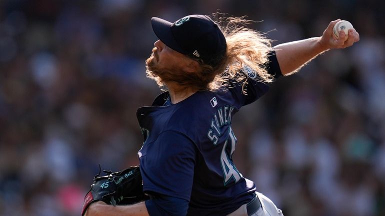 Mariners relief pitcher Ryne Stanek works against a Padres batter...