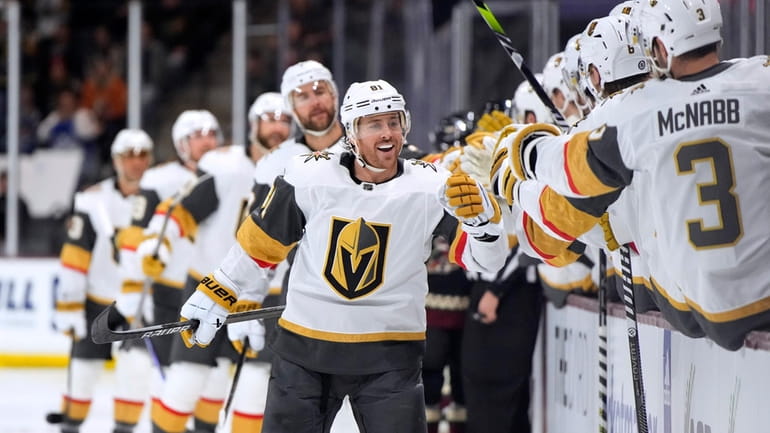Vegas Golden Knights right wing Jonathan Marchessault (81) is congratulated...