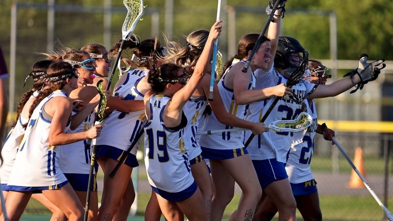 West Islip girls lacrosse celebrates after defeating Garden City in the...