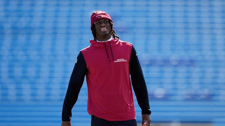 Arizona Cardinals' Marvin Harrison Jr. smiles before an NFL football...