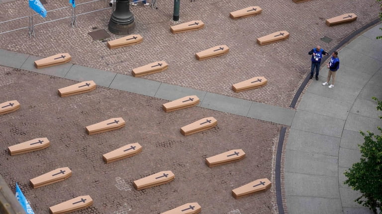 La Scala theatre square is filled with 172 coffins, as...
