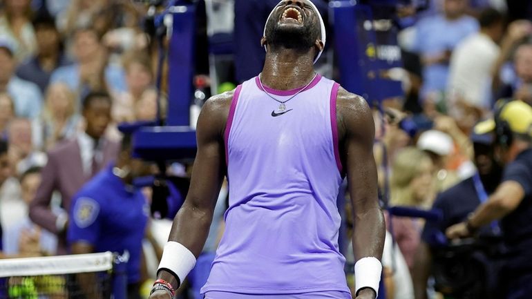 Frances Tiafoe, of the United States, reacts after defeating Alexei...