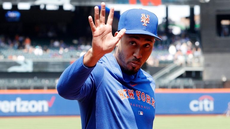 Edwin Diaz of the Mets waves to fans before a...