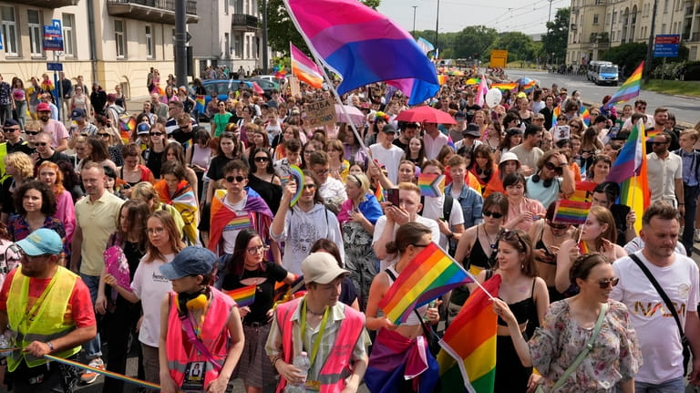 People take part in the Equality Parade, an LGBT pride...