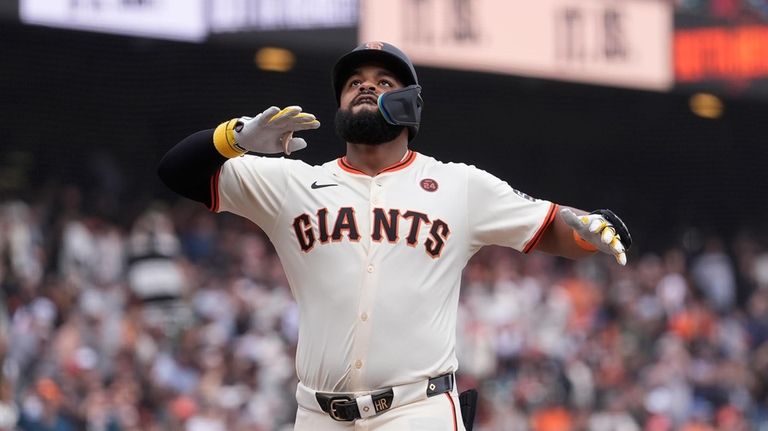 San Francisco Giants' Heliot Ramos celebrates after hitting a home...