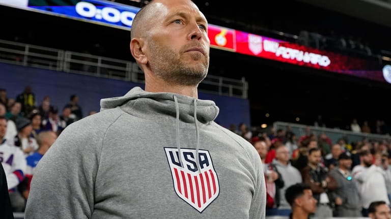 United States head coach Gregg Berhalter looks onto the pitch...