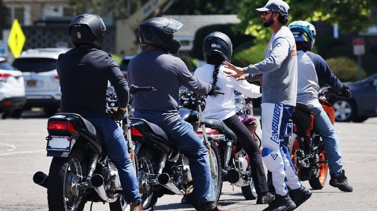 Herick Kumar, 30, of Hicksville, teaches a motorcycle safety course with...