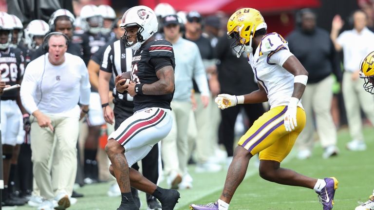 South Carolina quarterback LaNorris Sellers (16) gets out of bounds...