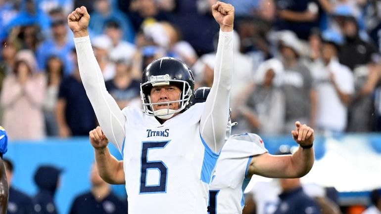 Tennessee Titans place-kicker Nick Folk celebrates after kicking a game-winning...