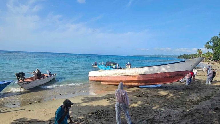 This photo provided by the Dominican Republic Civil Defense shows...