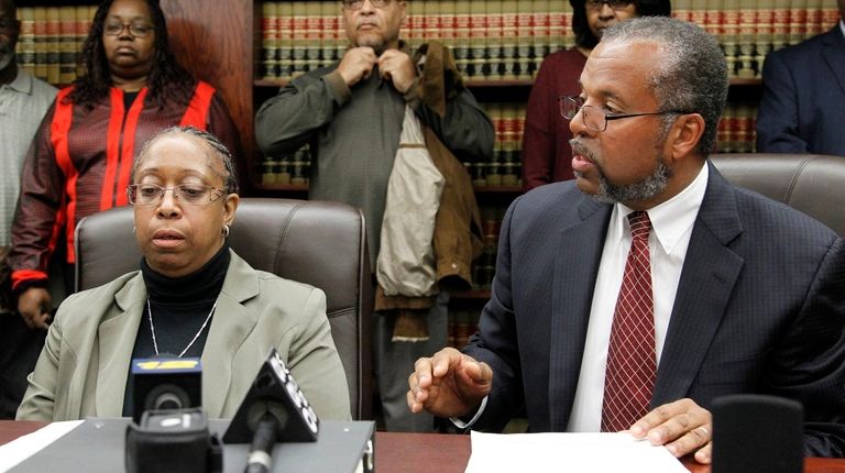 Former Nassau Police Officer Dolores Sharpe with her attorney Fred...