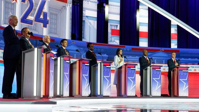 Republican presidential candidates, from left, former Arkansas Gov. Asa Hutchinson,...