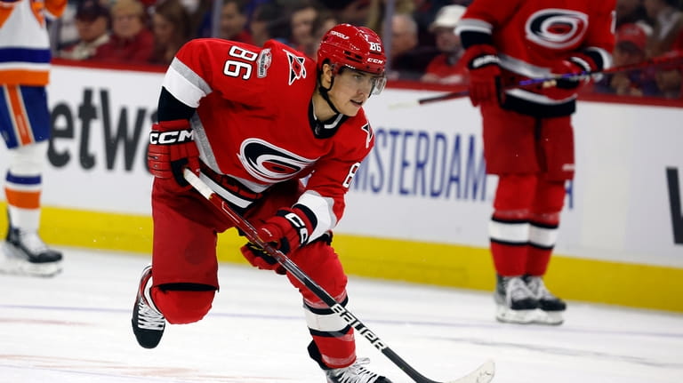 Carolina Hurricanes' Teuvo Teravainen (86) skates with the puck against...