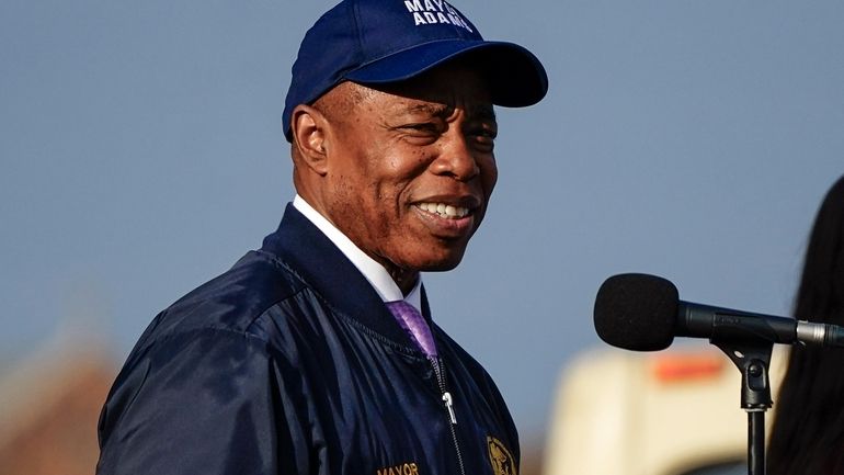 FILE — New York Mayor Eric Adams smiles while addressing...