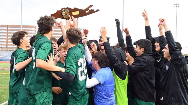 Carle Place celebrates its win in the LI Class B...