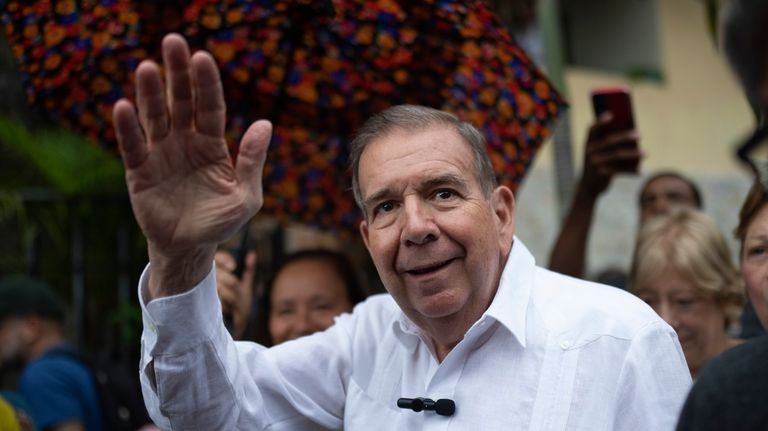 Venezuelan opposition presidential candidate Edmundo Gonzalez waves to supporters during...