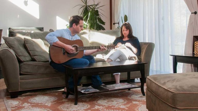 Sellers Charles Connolly and Maya Montemurro in their living room.