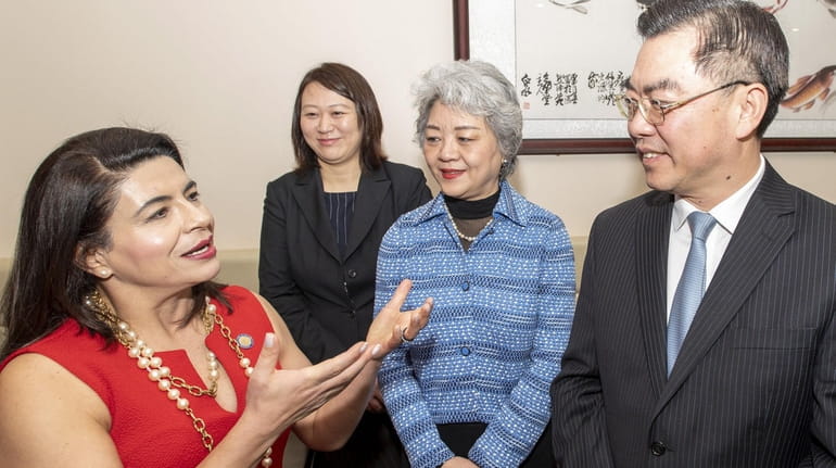 State Sen. Anna Kaplan, left, talks with China's Consul General in...