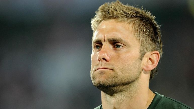 Robert Green of England looks dejected as he walks off...