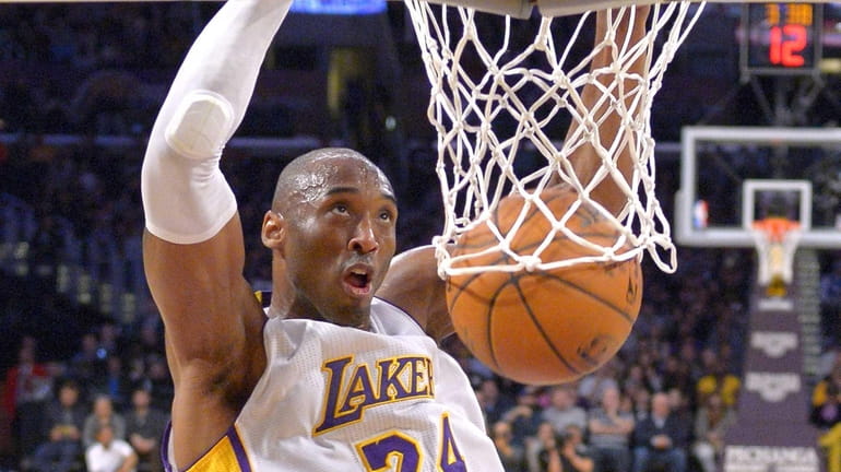 Kobe Bryant of the Los Angeles Lakers goes for a dunk against the