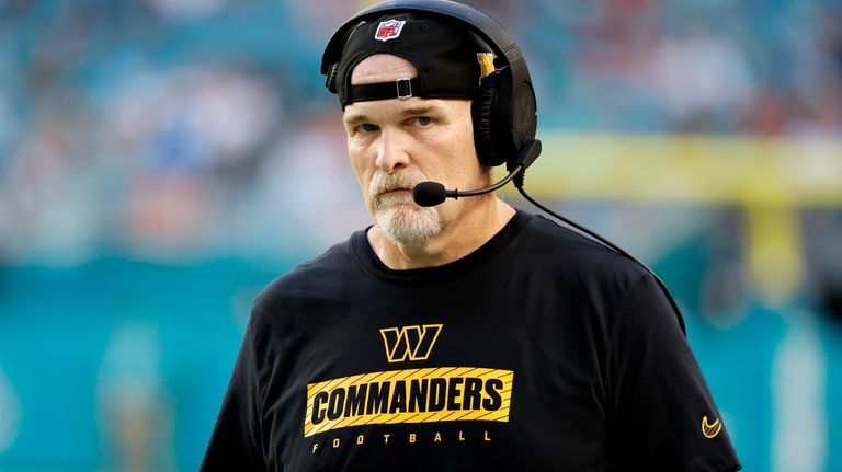 Washington Commanders head coach Dan Quinn watches during the first...