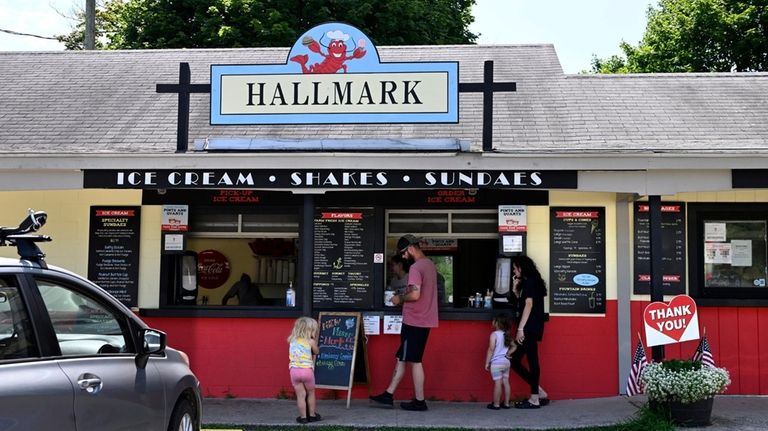 A family orders ice cream from Hallmark Drive In in...