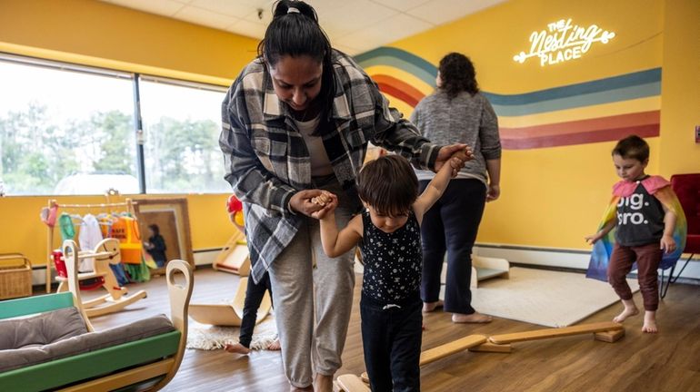 Manpreet and her son, Lukas, play at the Nesting Place...