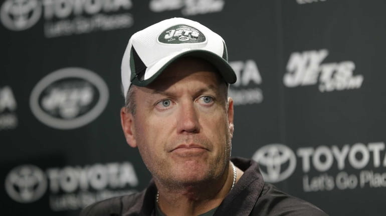 Rex Ryan talks to reporters after a practice in Florham...