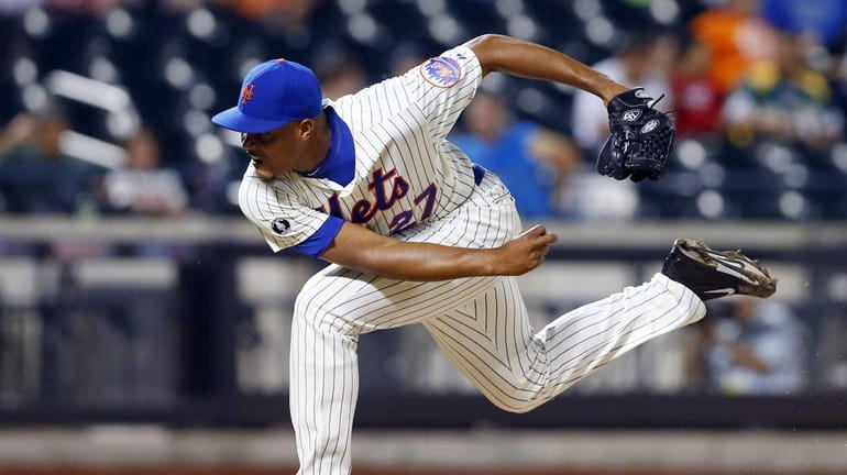 Jeurys Familia of the Mets pitches against the Oakland Athletics...