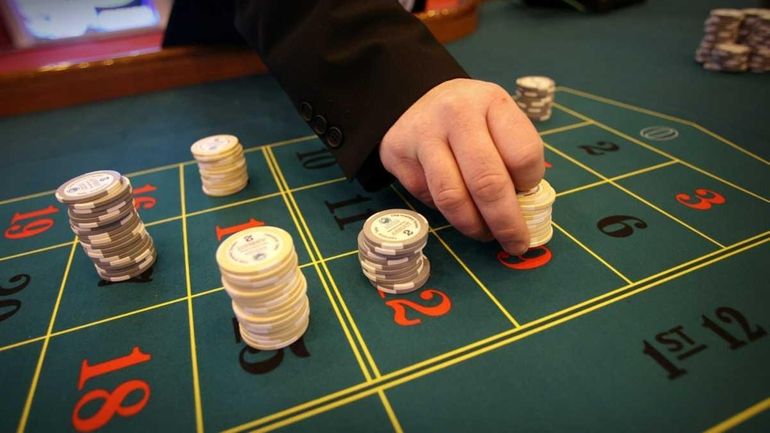 A file photo of a dealer placing chips at a...