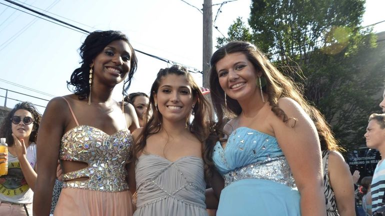 Lynbrook High School students pose for a shot walking down...