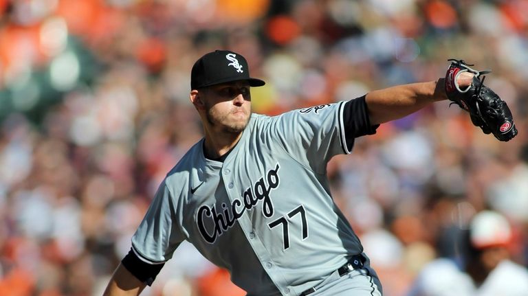 Chicago White Sox pitcher Chris Flexen delivers during the first...