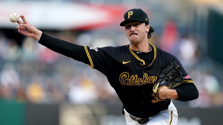 Pittsburgh Pirates starting pitcher Paul Skenes delivers during the third...