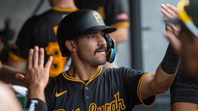 Pittsburgh Pirates' Nick Gonzales (39) is congratulated by his teammates...