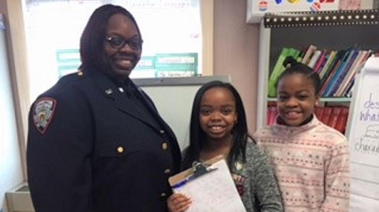 Kidsday reporters Jeniyah Santana, center, and Jaylannie Compere of Walnut Street...