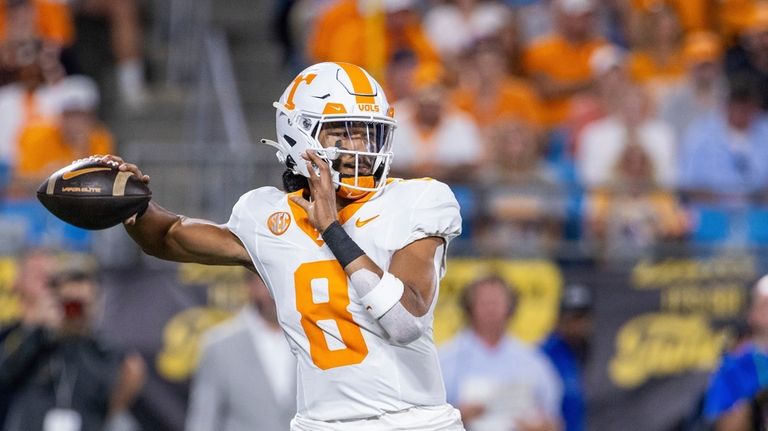 Tennessee quarterback Nico Iamaleava (8) throws against North Carolina State...