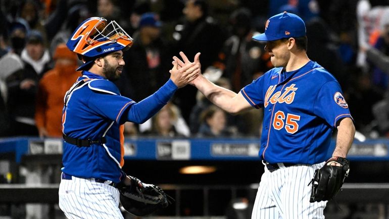 New York Mets relief pitcher Trevor May (65) celebrates with...