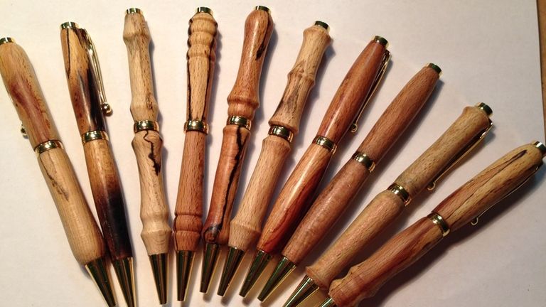 Eddie Piotrowski crafts pens from wood.