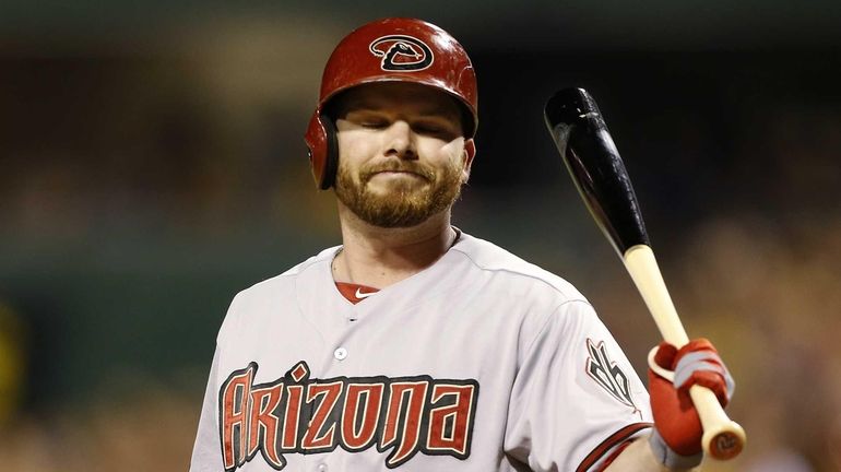 Arizona Diamondbacks' pinch-hitter Jason Kubel reacts after striking out against...