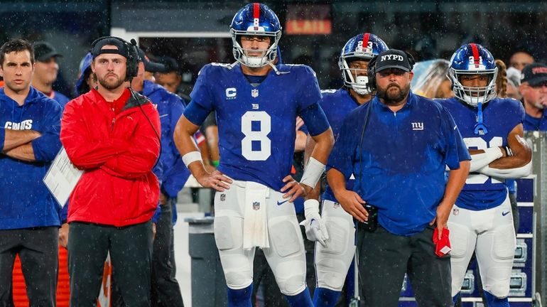 Giants quarterback Daniel Jones and coach Brian Daboll look on...