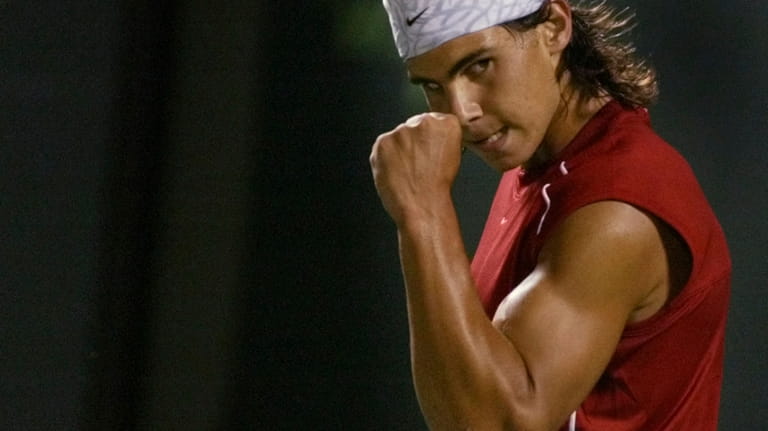 Rafael Nadal of Spain celebrates winning a point against Roger...