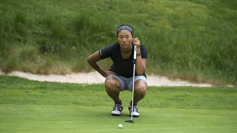 MacArthur High School's Annie Park lining up her putt at...