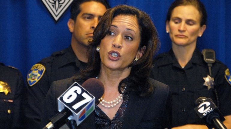 Then-California Attorney General Kamala Harris announces the arrest of a...