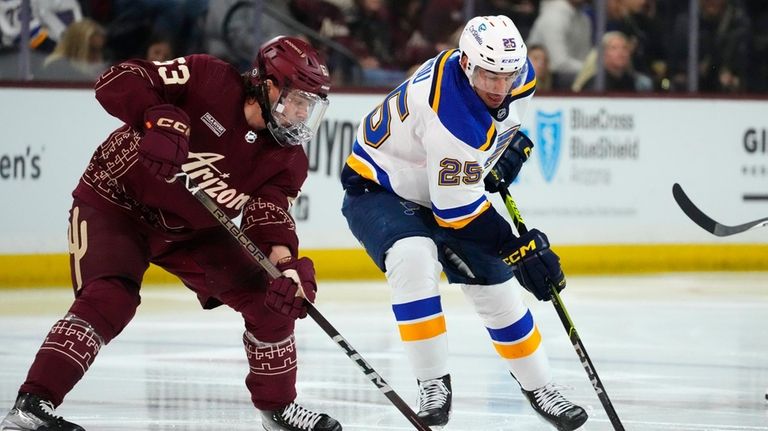 St. Louis Blues center Jordan Kyrou (25) skates with the...