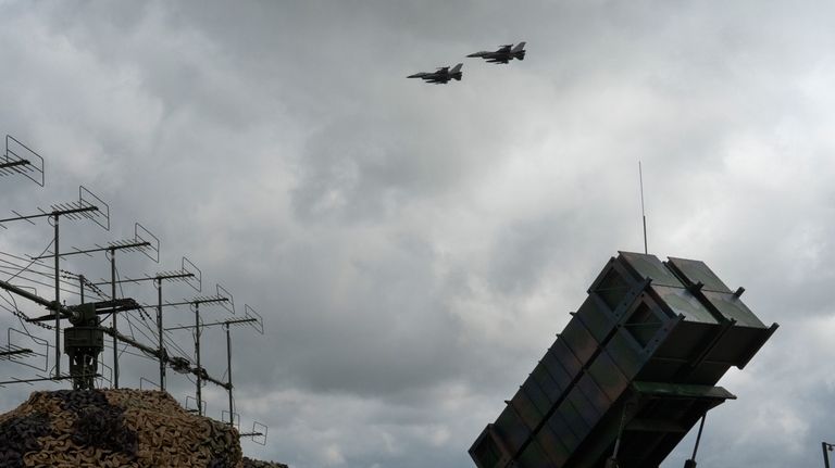 The Ukrainian Air Force's F-16 fighter jets fly over a...